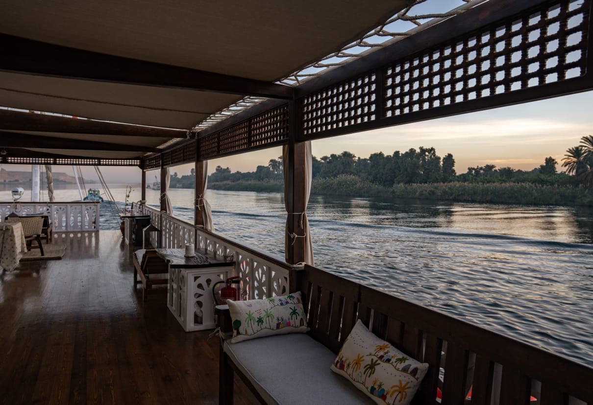 Mashrabiya promenade lounge with handcrafted Nubian pillows